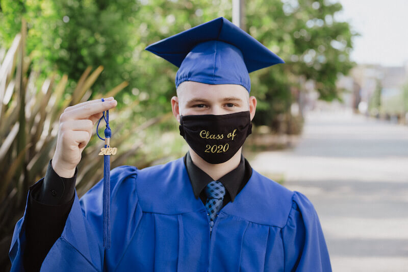 Happy graduate student with a certificate after graduation ceremony at the university. High school seniors are in coronavirus ‘limbo’ with college deposits due